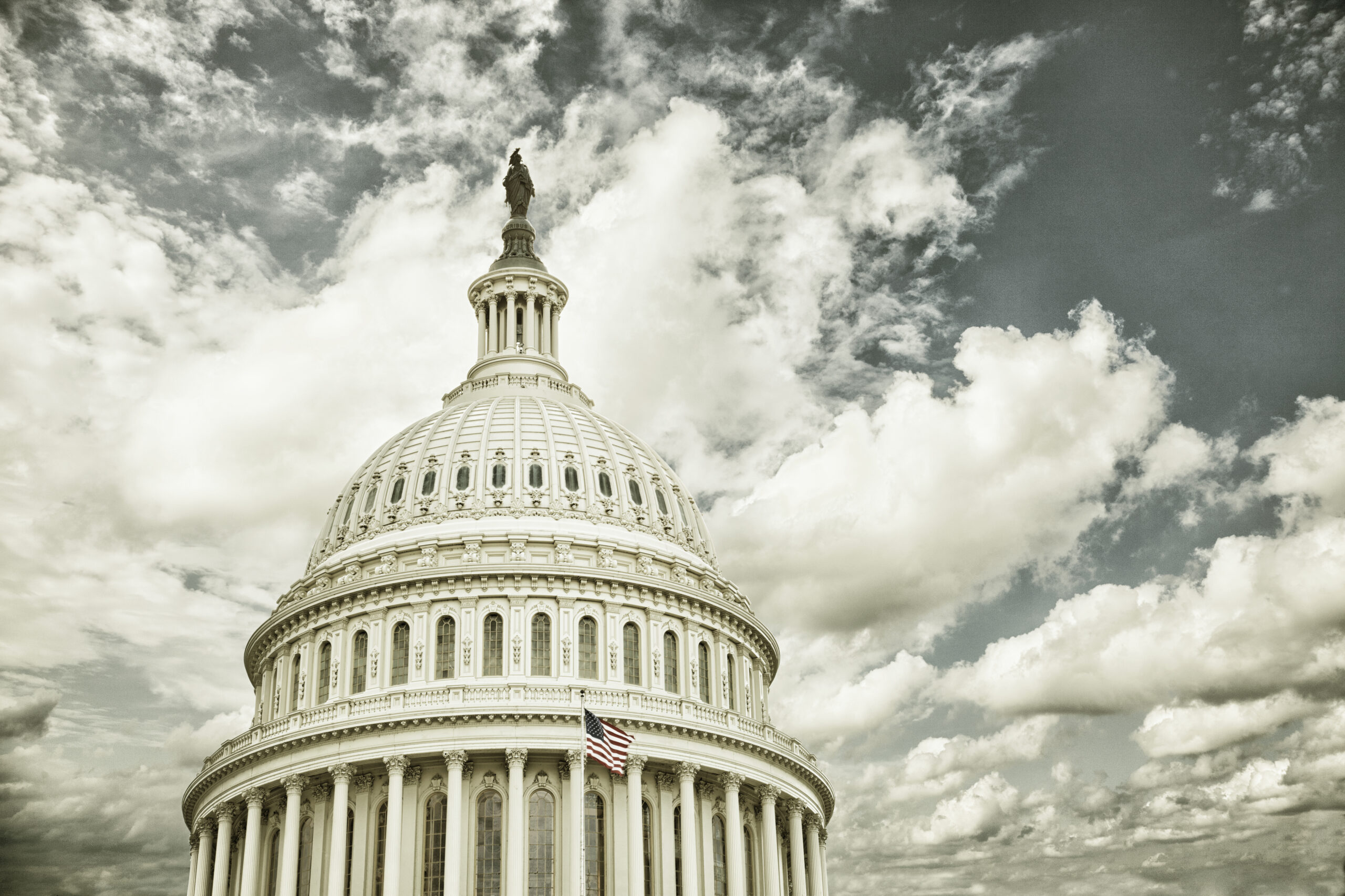 Cross processed US Capitol dome with clouds